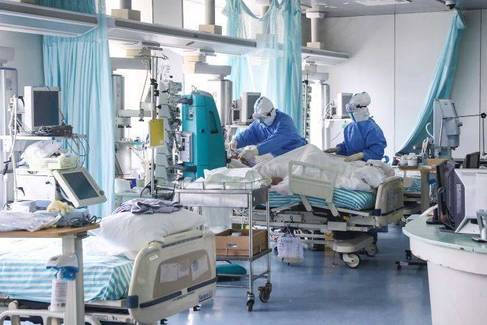 Sydney hospitals under strain as coronavirus cases hit record